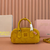 ARCADIE BAG 22 IN MUSTARD YELLOW SUEDE GOLD HARDWARE